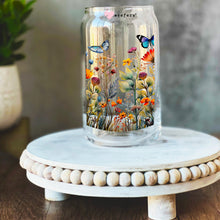 Load image into Gallery viewer, a glass jar with a painting of flowers and butterflies on it
