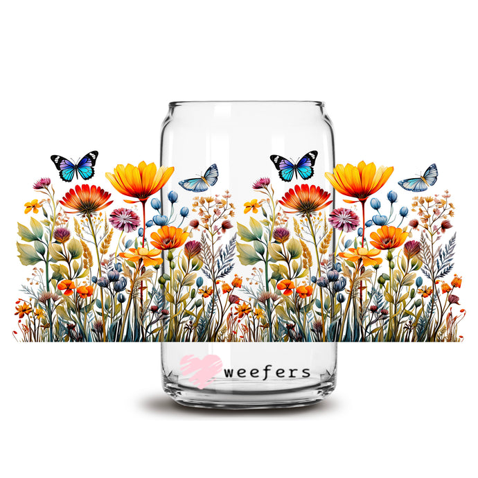 a glass jar with flowers and butterflies painted on it