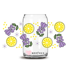 Load image into Gallery viewer, a glass jar filled with lemons and purple flowers
