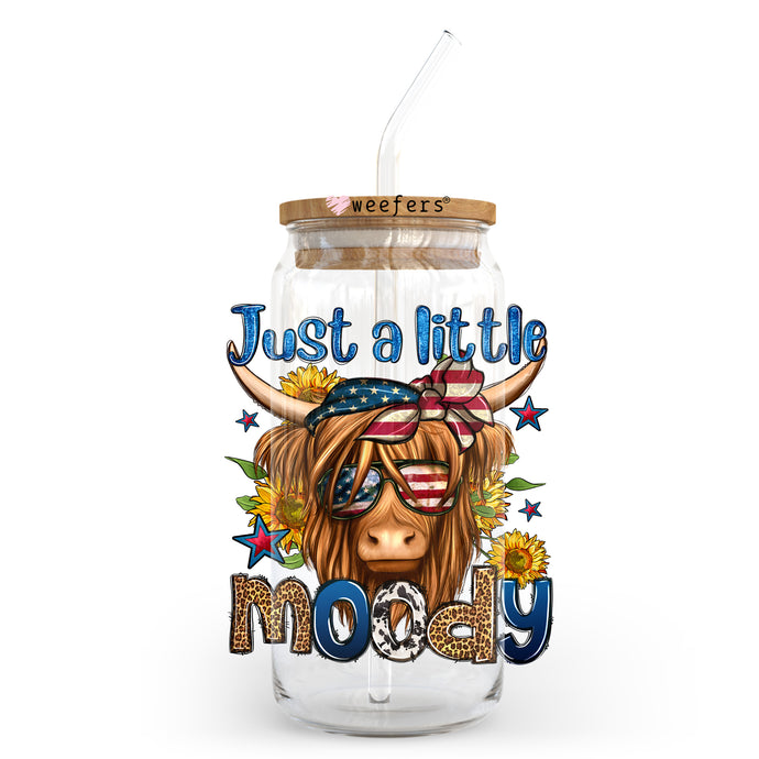 a glass jar with a straw in it that says just a little moody