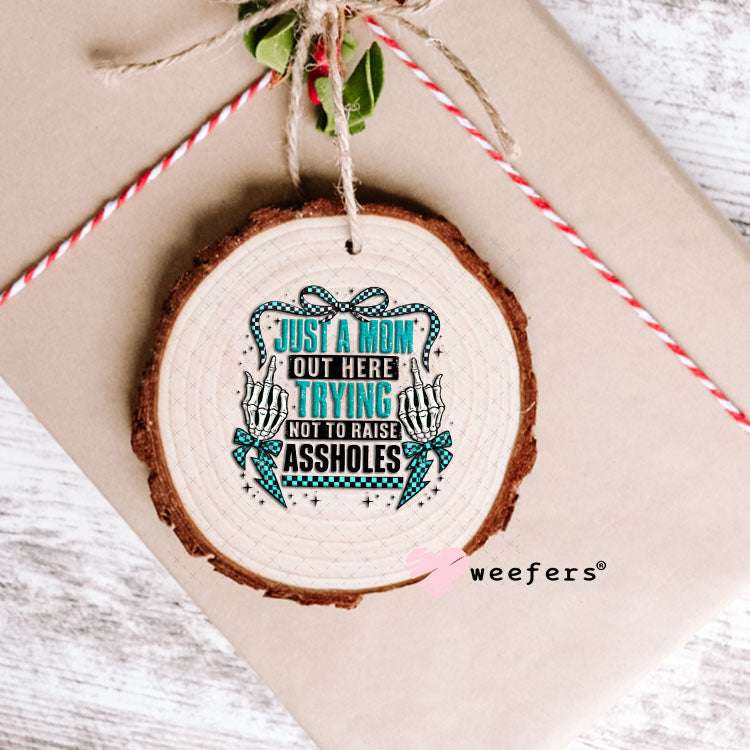 UV DTF Decal - Just a Mom Out Here Trying Not to Raise Assholes Ornament Weefers
