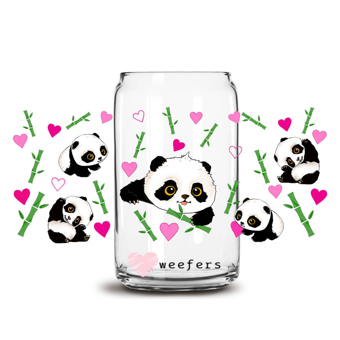 a glass jar filled with panda bears surrounded by hearts