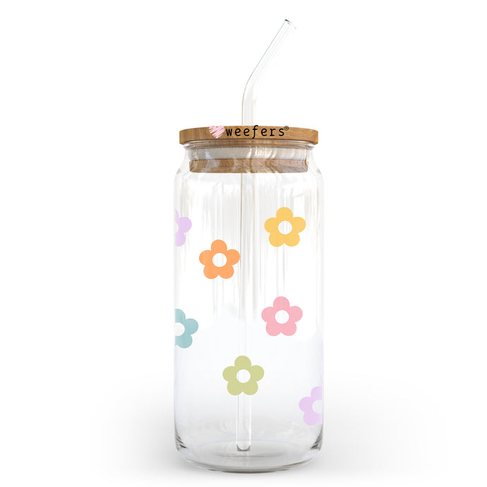 a glass jar with a straw and a flower pattern