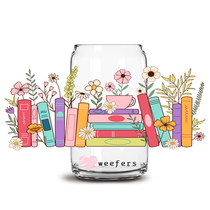 a glass jar filled with books and flowers