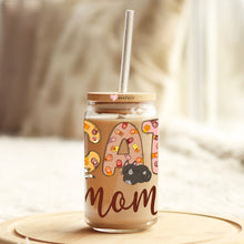 Load image into Gallery viewer, a mason jar with a straw in it sitting on a table
