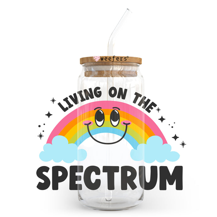 a jar with a straw in it that says living on the spectrum