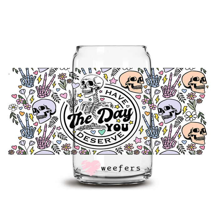 a glass with a skull on it and the words, the day of the dead