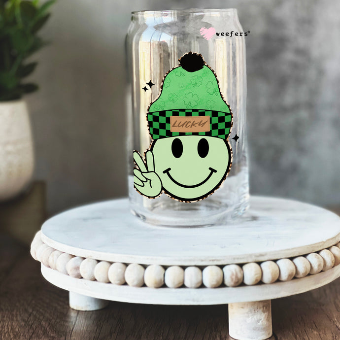 a glass with a picture of a smiling face on it