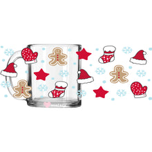 Load image into Gallery viewer, a glass mug with gingerbreads and santa hats on it
