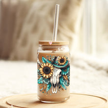 Load image into Gallery viewer, a mason jar with a straw in it with a cow skull and sunflowers
