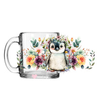 Load image into Gallery viewer, a glass mug with an image of a penguin on it
