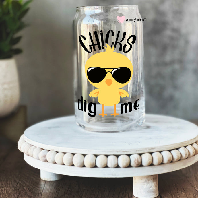 a glass jar with a yellow bird wearing sunglasses