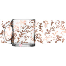 Load image into Gallery viewer, a glass mug with a floral design on it
