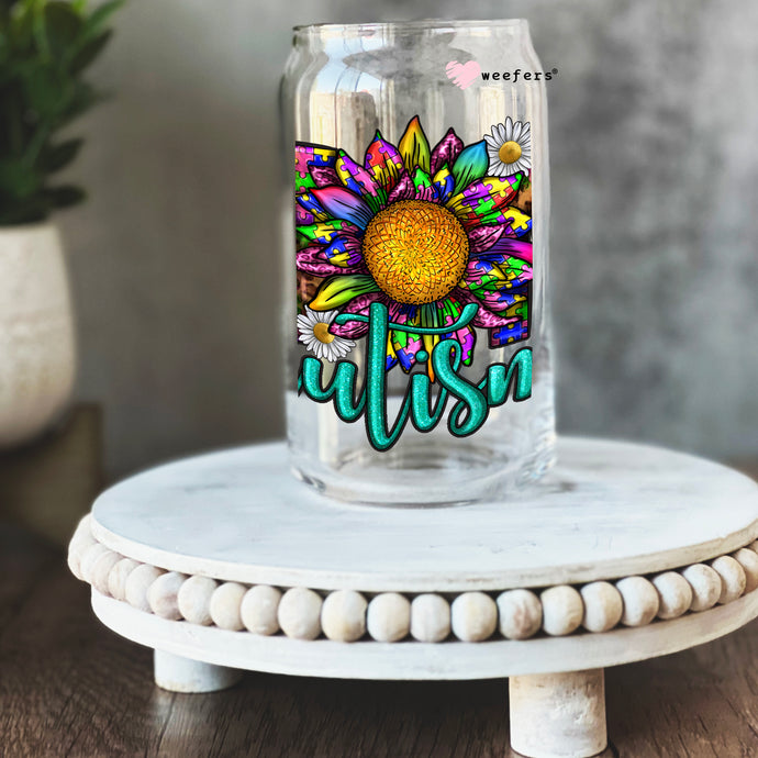 a glass jar with a sunflower painted on it