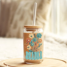 Load image into Gallery viewer, a mason jar with a straw in it sitting on a table
