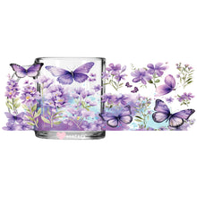 Load image into Gallery viewer, a glass with purple flowers and butterflies on it
