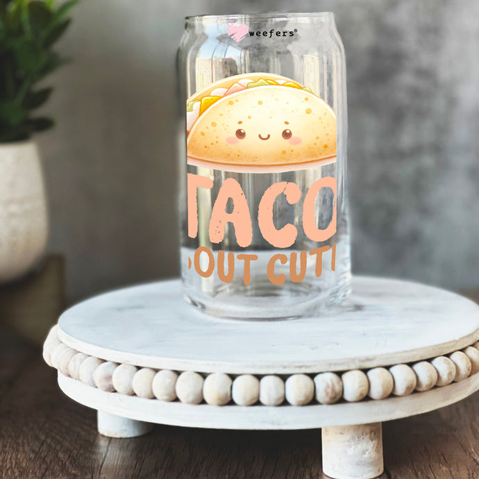 a glass jar with taco out cut on it