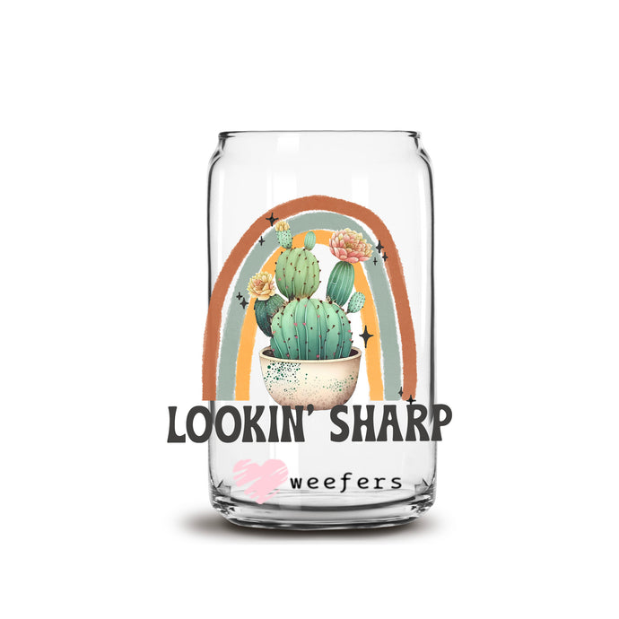 a glass jar with a picture of a cactus in it