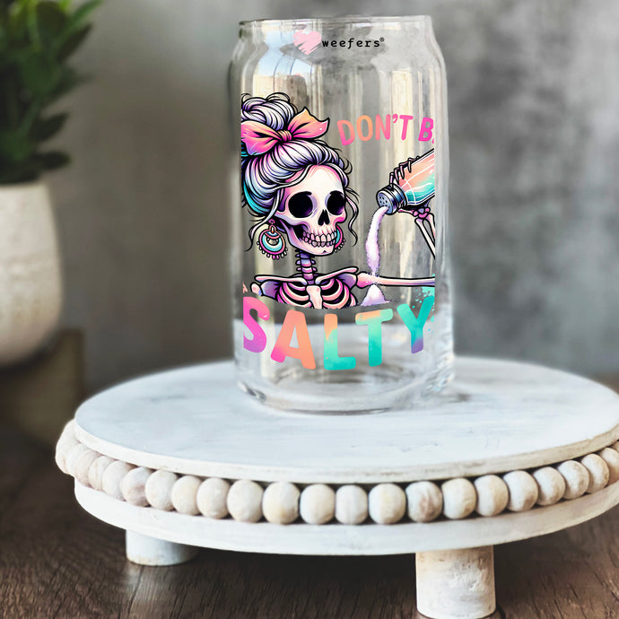 a glass jar with a picture of a skeleton on it