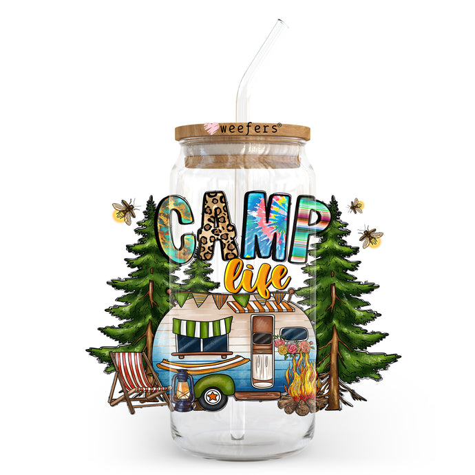 a glass jar with a camp like design on it