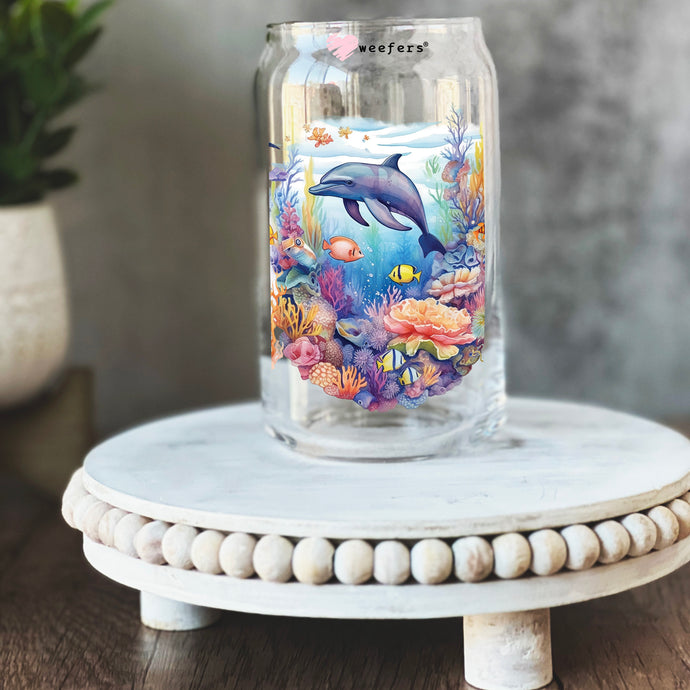 a glass jar with a picture of a dolphin on it