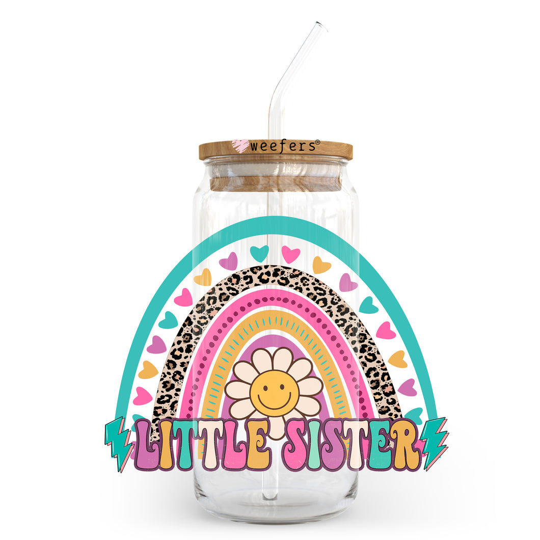 a glass jar with a straw in it and a little sister sticker on the