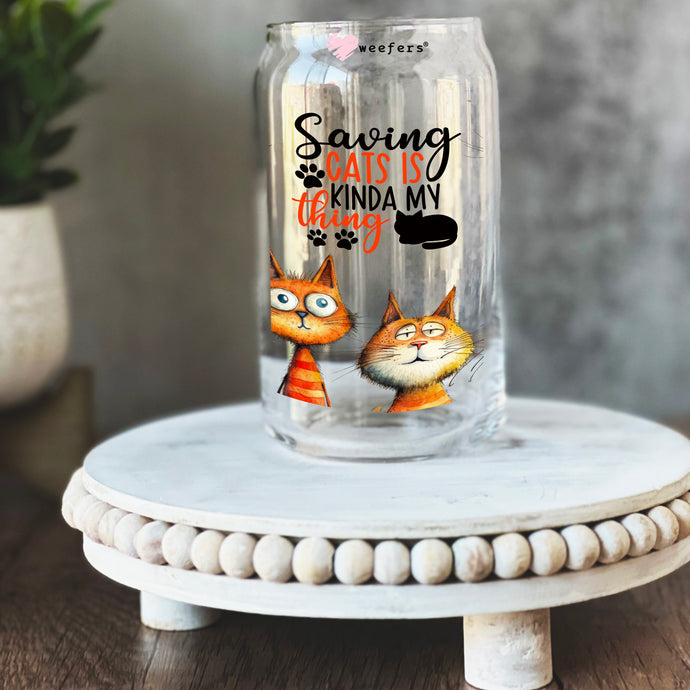 a glass jar with a picture of two cats on it