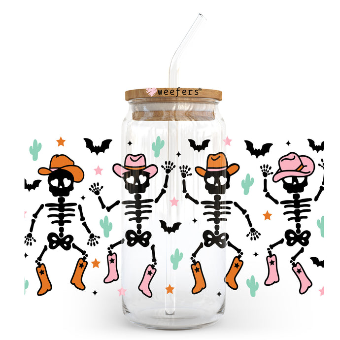 a glass jar with a skeleton design and a straw in it