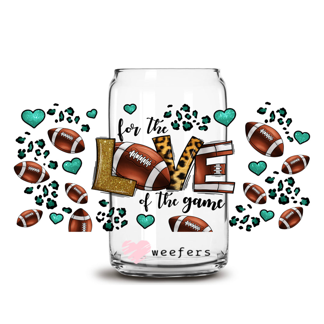 a glass jar filled with footballs and hearts