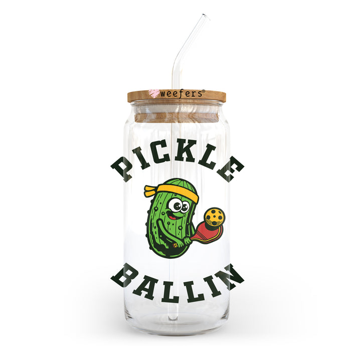 a pickle ball jar with a straw in it