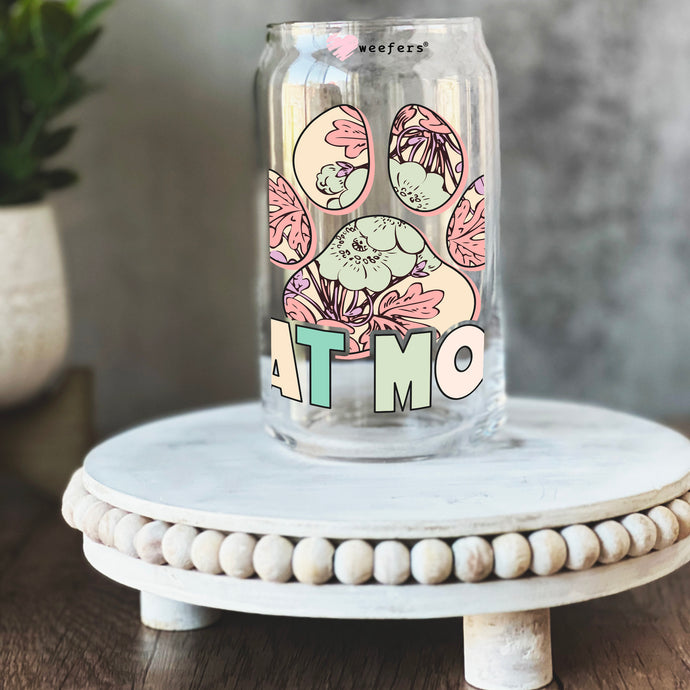 a glass jar with the word atmo painted on it