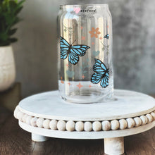 Load image into Gallery viewer, a glass jar with butterflies painted on it
