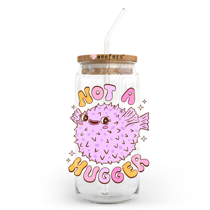 a glass jar with a straw in it that says not a hugger