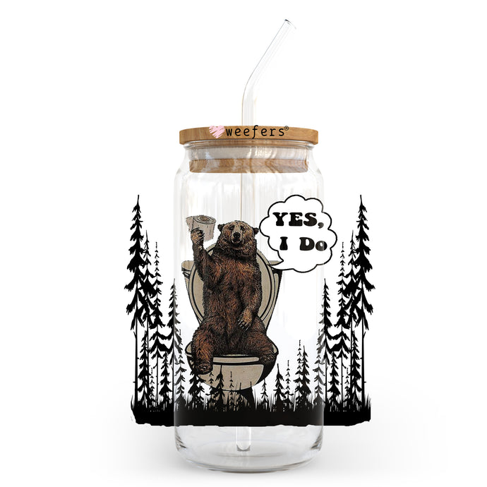 a glass jar with a bear sitting on a toilet