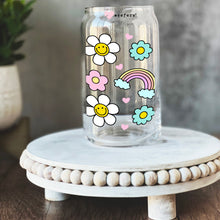 Load image into Gallery viewer, a glass jar with flowers and a rainbow painted on it
