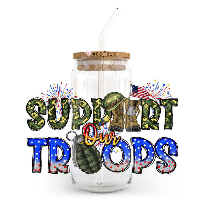 a glass jar with a straw in it that says support our troops