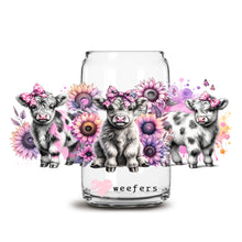 Load image into Gallery viewer, a glass jar with three little cows in it
