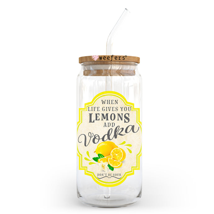 a glass jar filled with lemons and a straw