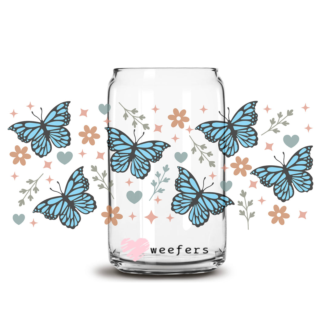 a glass jar filled with blue butterflies on a white background