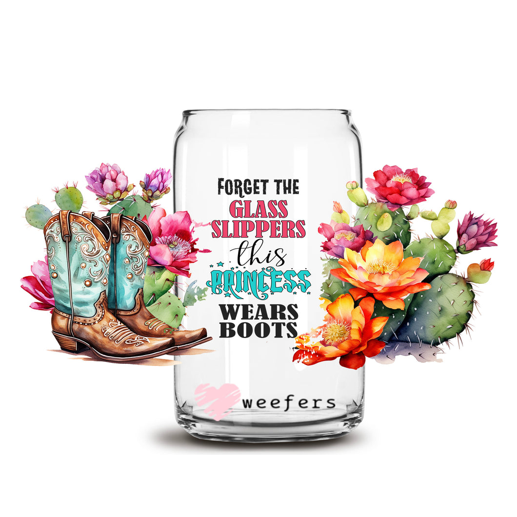a glass jar with flowers and cowboy boots on it