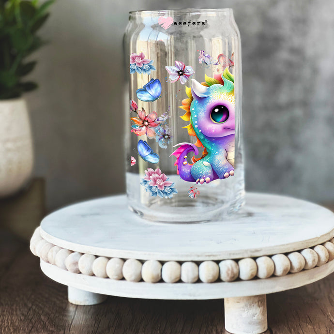 a glass jar with a picture of a dragon inside