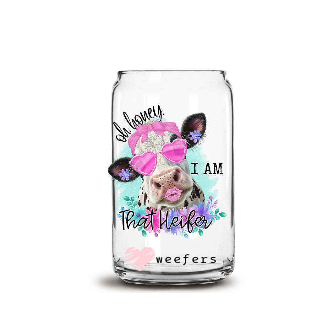 a glass jar with a cow wearing a pink bow