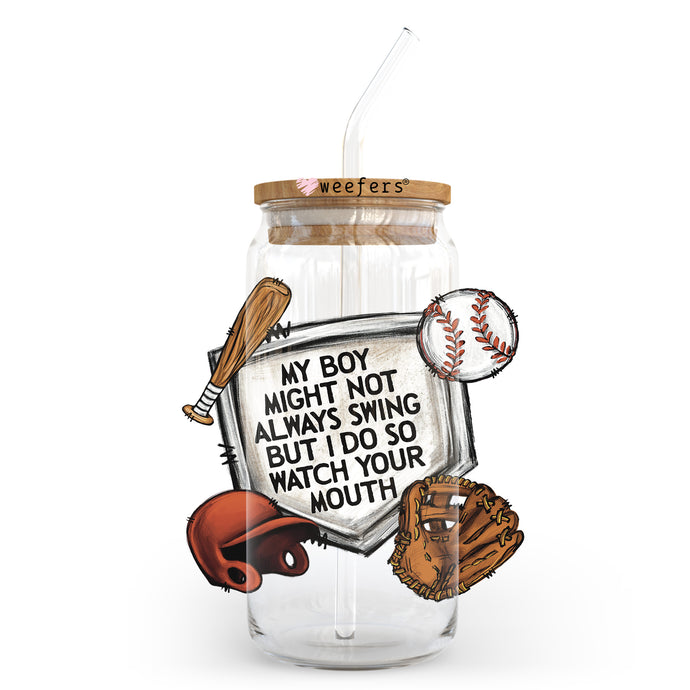 a glass jar with some baseball items inside of it