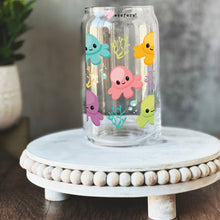 Load image into Gallery viewer, a glass jar with an octopus design on it

