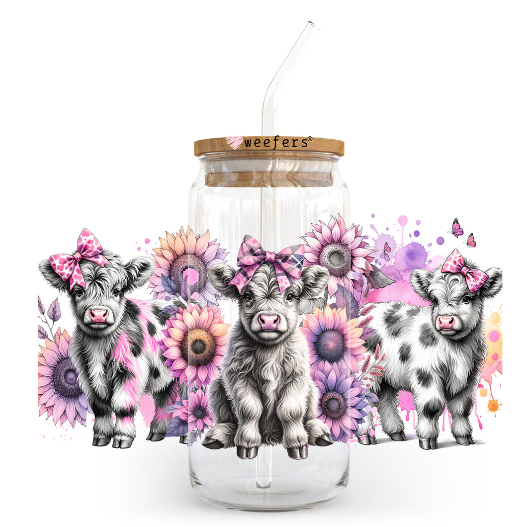 a glass jar with three little cows inside of it