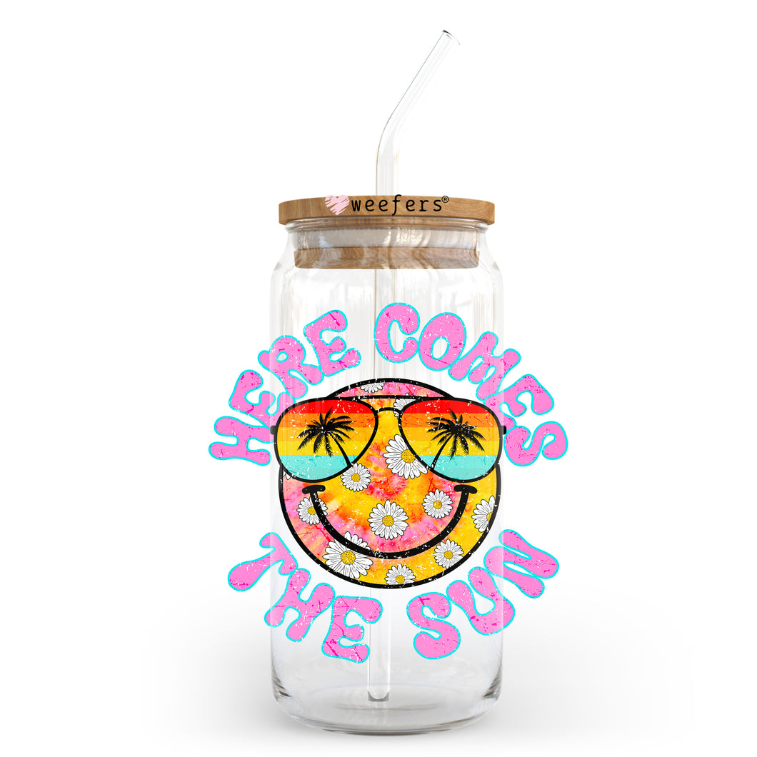 a glass jar with a straw in it that says here comes the sun
