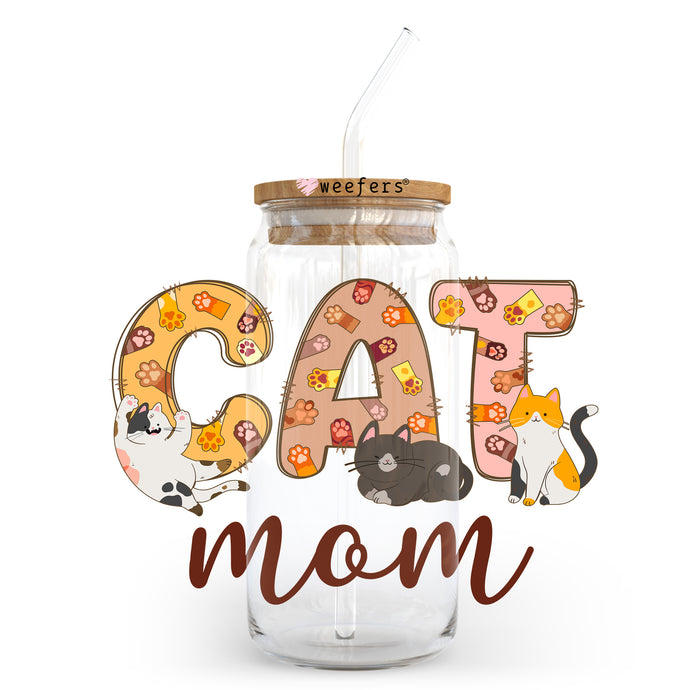 a cat mom jar with a straw in it