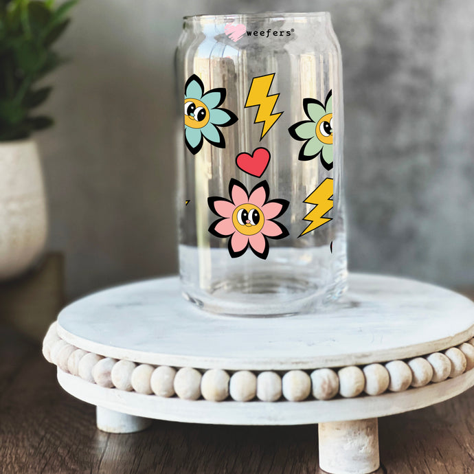 a glass jar with a flower and lightning sticker on it