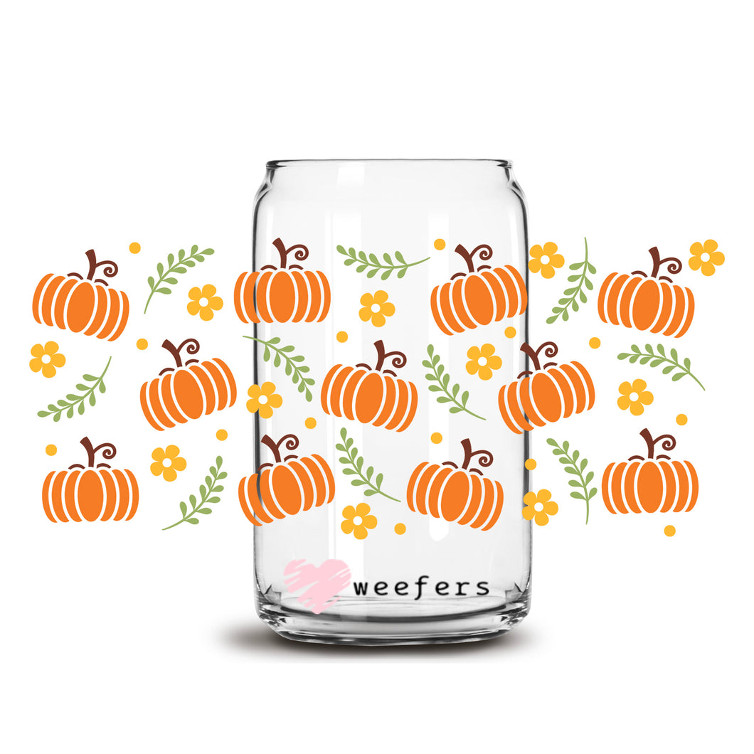 a glass jar with a pattern of pumpkins on it