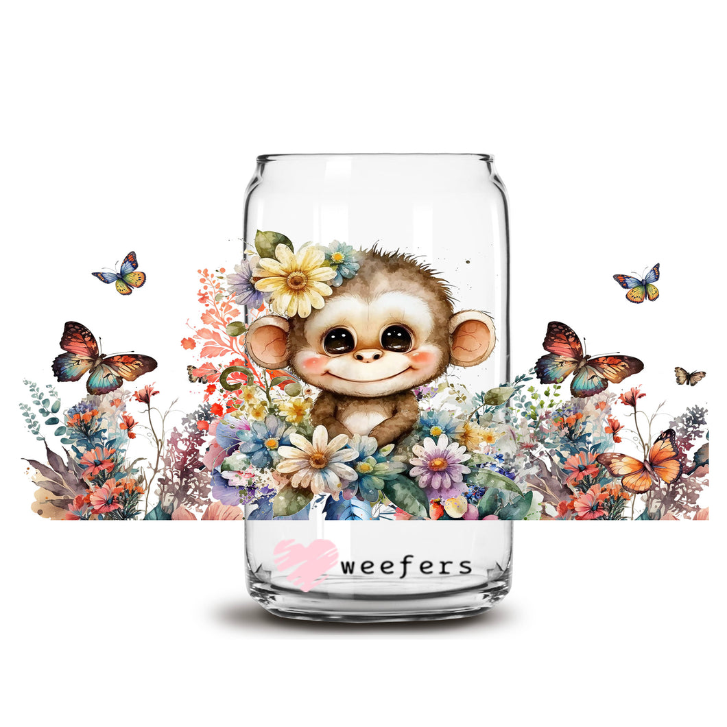 a glass jar with a monkey inside of it